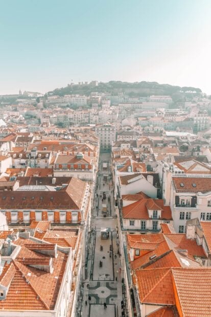 A narrow street runs through the historic buildings in Lisbon Portugal, HD Mobile Wallpaper