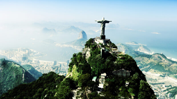 Christ The Redeemer stands above Rio de Janeiro with city and ocean views, HD Desktop Wallpaper
