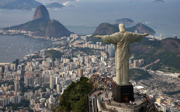 The Christ The Redeemer statue stands tall above Rio de Janeiro with mountains in the background, HD Desktop Wallpaper