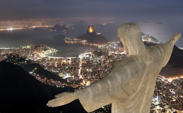 The Christ The Redeemer statue overlooks the illuminated cityscape of Rio de Janeiro at night, HD Desktop Wallpaper