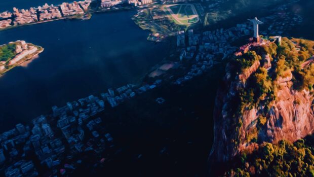 The Christ The Redeemer statue overlooks the city of Rio de Janeiro and the bay during sunset, 4K Desktop Wallpaper