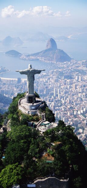 The Christ The Redeemer statue stands tall overlooking the city of Rio de Janeiro and the bay beyond, 2K Mobile Wallpaper