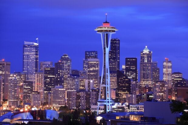 Night view of the city skyline featuring the iconic Space Needle in City Skylines