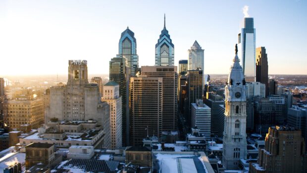 Stunning city skylines featuring iconic skyscrapers under a clear sky in the morning sunlight