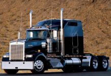 A Kenworth truck stands against a dry mountain backdrop, HD Desktop Wallpaper