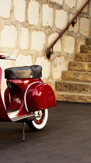 A classic red scooter stands near a stone wall and stairs in this image, HD Phone Wallpaper