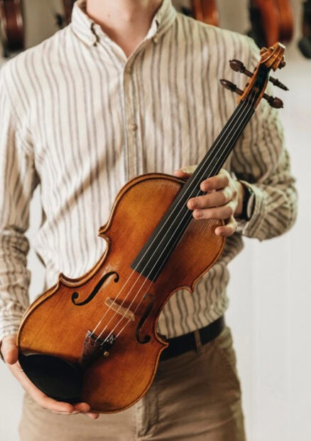 A person holds a classic wooden violin in their hands, HD Mobile Wallpaper