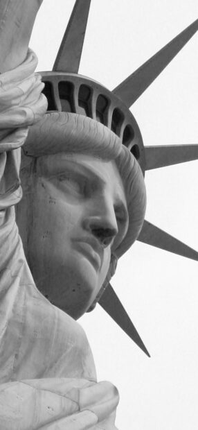 Close up black and white of the Statue of Liberty face showing detailed features, HD Phone Wallpaper