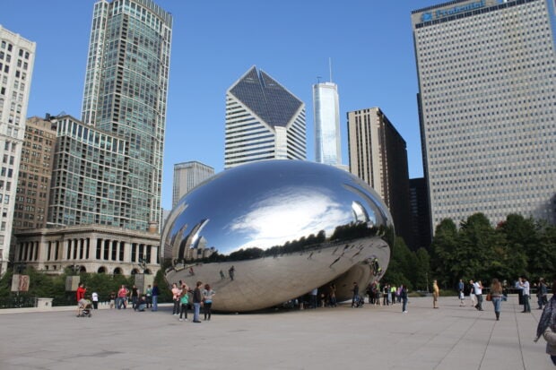 The Cloud Gate Chicago sculpture reflects the city skyline and people in Millennium Park, 2K Desktop Wallpaper