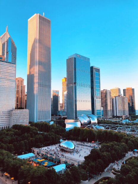 An aerial view shows Cloud Gate and surrounding skyscrapers in Chicago, 2K Mobile Wallpaper