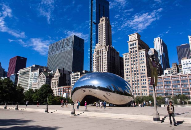 The Cloud Gate sculpture in Chicago reflects the city skyline on a clear blue day, HD Desktop Wallpaper