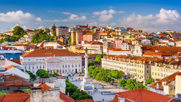 A vibrant view of Lisbon Portugal city with classic buildings and plaza, HD Desktop Wallpaper
