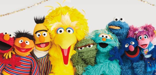 The Sesame Street characters smile and pose together in a lively group photo, HD Desktop Wallpaper