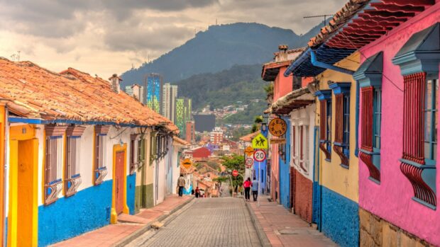 A street in Bogota with colorful buildings and distant mountains in the background, HD Desktop Wallpaper