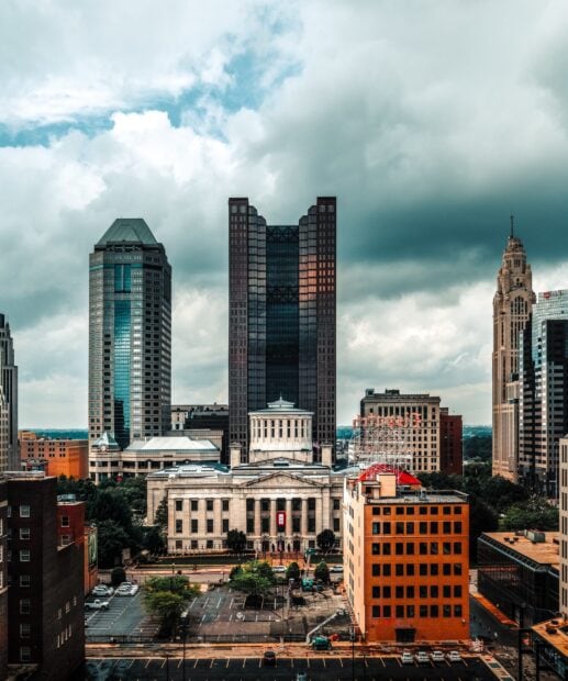 Historic Columbus Ohio skyline with modern skyscrapers under cloudy sky