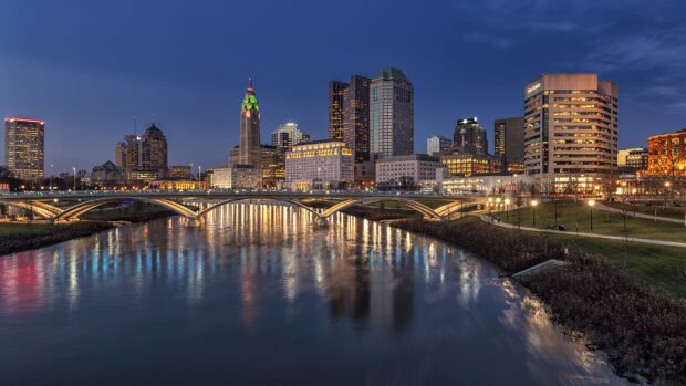 Evening cityscape with Columbus Ohio skyline and river reflection