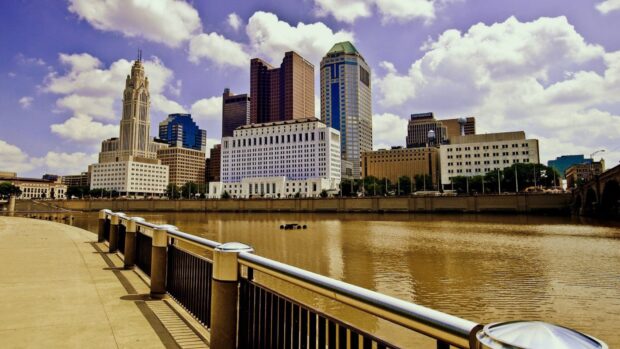 Columbus Ohio skyline with river and buildings in clear weather