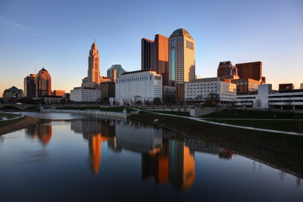Columbus downtown skyline reflecting on the river during sunset in Columbus Ohio