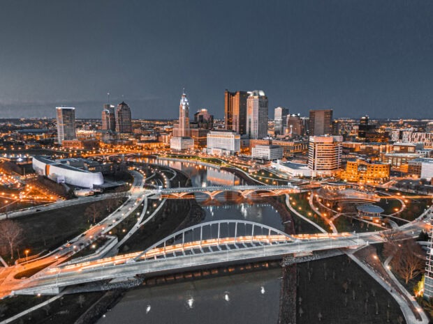 The Columbus Ohio cityscape with illuminated bridges and skyline at night