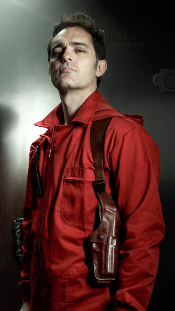 A confident man wears a red outfit with a leather holster, 4K Phone Wallpaper