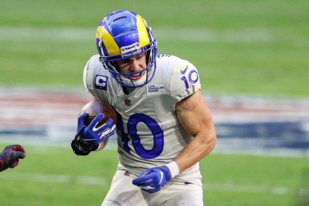 Cooper Kupp running with the football in a Los Angeles Rams uniform during a game