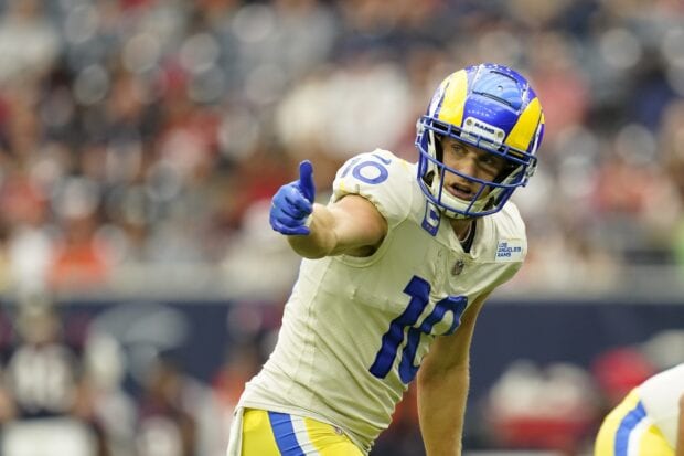 Cooper Kupp wearing Los Angeles Rams uniform giving thumbs up on field during game