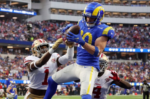Cooper Kupp making a catch during a football game against the 49ers defenders