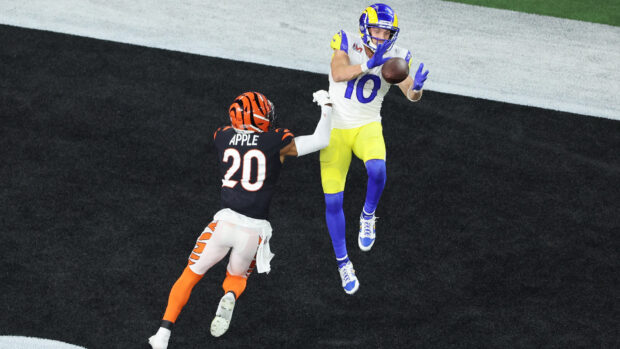 Cooper Kupp catching a pass during a football game with a defender nearby