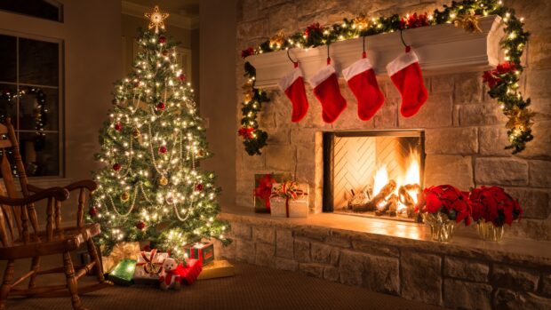 A cozy Christmas tree with stockings and a fire in the fireplace, 4K Desktop Wallpaper