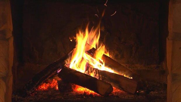 A cozy burning fire with glowing logs inside the fireplace during the night, HD Desktop Wallpaper