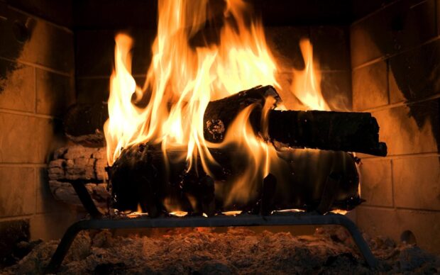 A burning fireplace with glowing logs and warm flames inside the hearth, HD Desktop Wallpaper