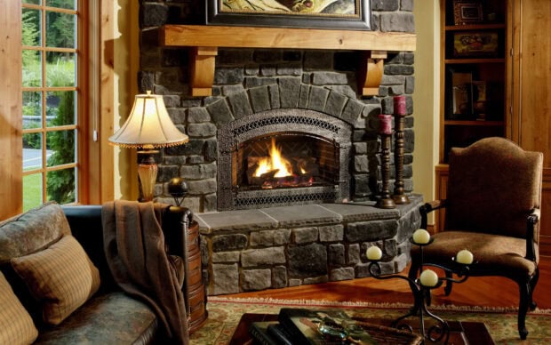 A warm fire burns inside a stone fireplace in a cozy living room, HD Desktop Wallpaper