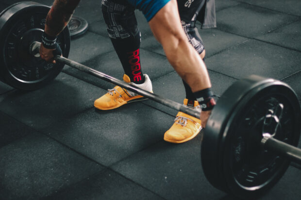 A person is preparing to lift a heavy barbell during a Crossfit workout session, HD Desktop Wallpaper