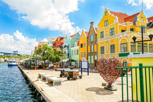 Historic buildings and colorful houses along the waterfront in Curacao Island