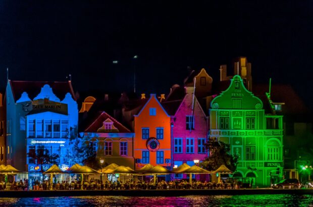 Colorful Curacao buildings illuminated at night along the waterfront