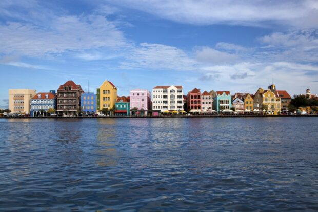 Colorful Curacao Island buildings along the waterfront under a blue sky