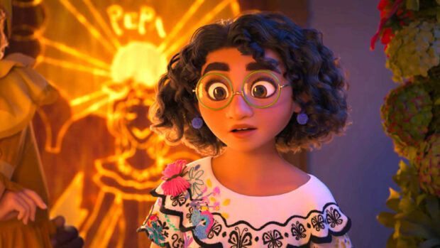 A girl with curly hair and glasses stands near glowing artwork in an Encanto scene, HD Desktop Wallpaper