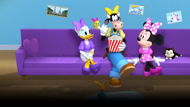Daisy Duck sitting on a purple couch next to animated characters in a colorful living room