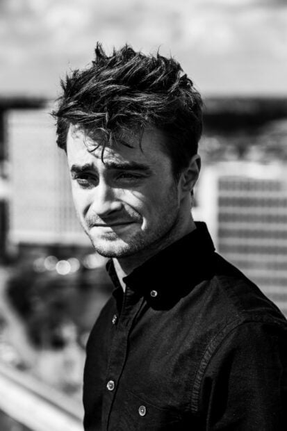 Daniel Radcliffe wallpapers in a thoughtful pose outdoors, HD Mobile Wallpaper