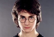 Daniel Radcliffe is looking straight at the camera with round glasses and serious expression, HD Desktop Wallpaper