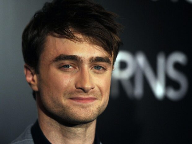 Daniel Radcliffe looks directly at the camera with a soft smile, HD Desktop Wallpaper