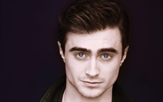 A close up portrait of Daniel Radcliffe with intense blue eyes and dark hair, HD Desktop Wallpaper