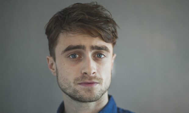 A close up portrait of Daniel Radcliffe with a neutral expression, 2K PC Wallpaper