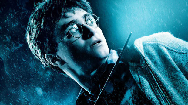 Daniel Radcliffe holds a wand while looking up in the rainy night, HD Desktop Wallpaper