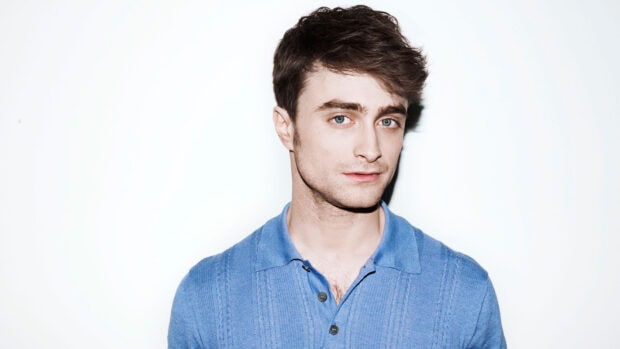 Daniel Radcliffe appears in a close up shot wearing a blue shirt with a neutral expression, HD Desktop Wallpaper