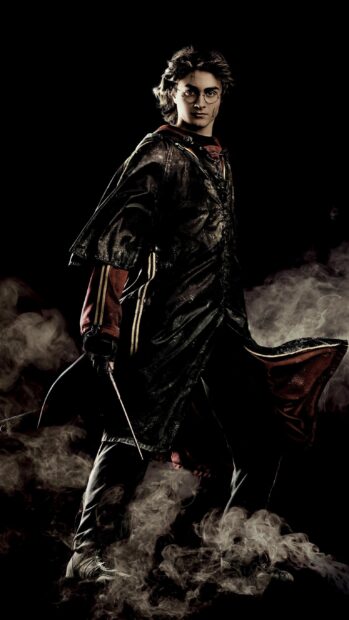 Daniel Radcliffe wallpapers showing a magical warrior with a wand and intense expression, 2K Mobile Wallpaper