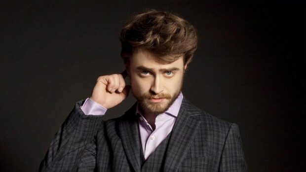 Daniel Radcliffe wallpapers showing him in a dark suit with a serious expression, HD Desktop Wallpaper