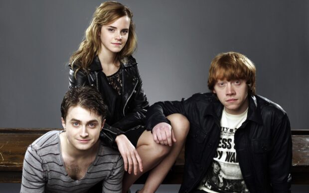 Daniel Radcliffe and co stars sitting together in a studio setting, 2K Desktop Wallpaper