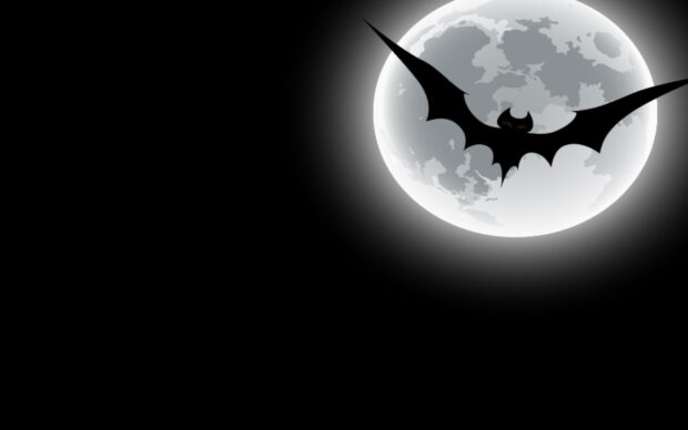 A dark bat silhouette flies against a bright full moon in the night sky, 2K Desktop Wallpaper