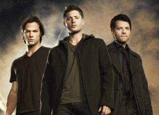 Dean Winchester standing with his brothers in a dramatic scene
